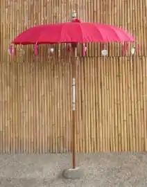Bali umbrella, rose red with metal coins and silver hearts hanging around the edge, ø 190 cm and 250cm height 